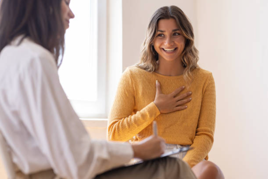 smiling woman speaking with a doctor